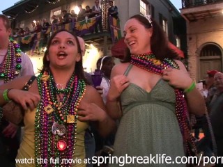 Black chick flashing beads during mardi