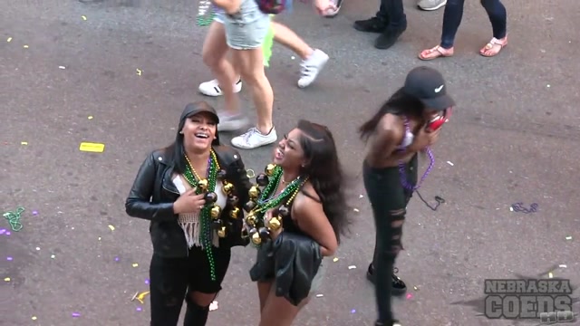 Black chick flashing beads during mardi