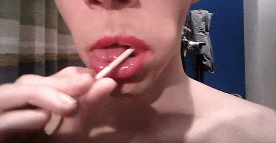 Glossy lips with sucking cigarette close