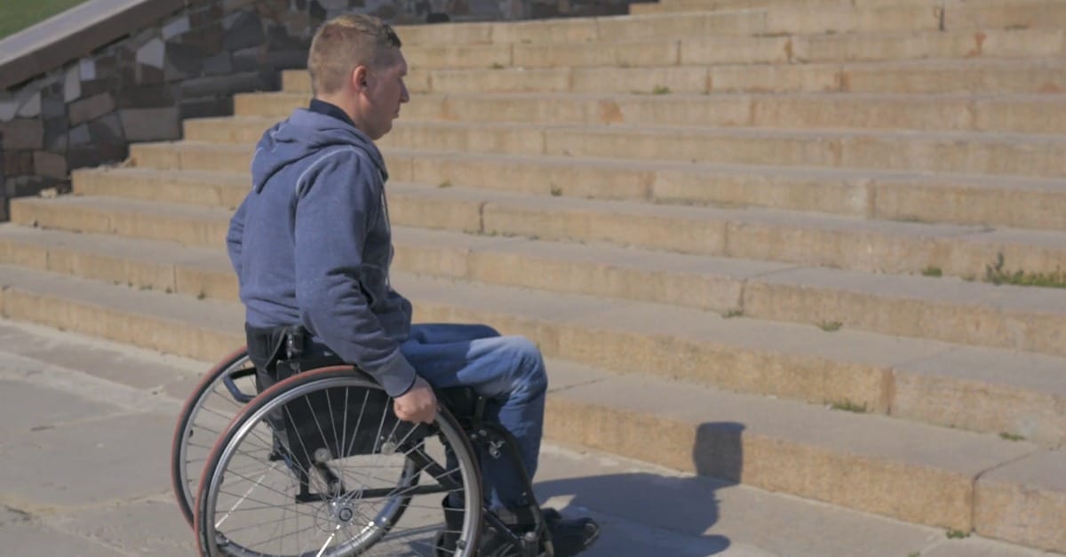 Quadriplegic stroking cock wheelchair